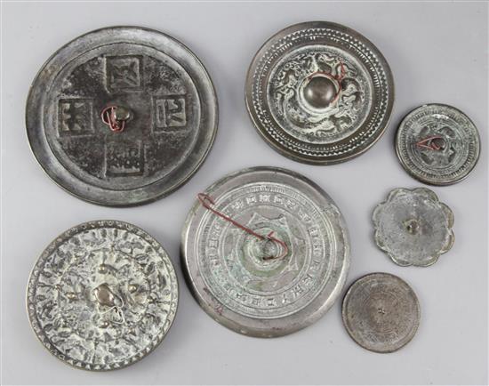 Seven Chinese bronze hand mirrors, Han dynasty to Ming dynasty, 4.9 to 12.6cm